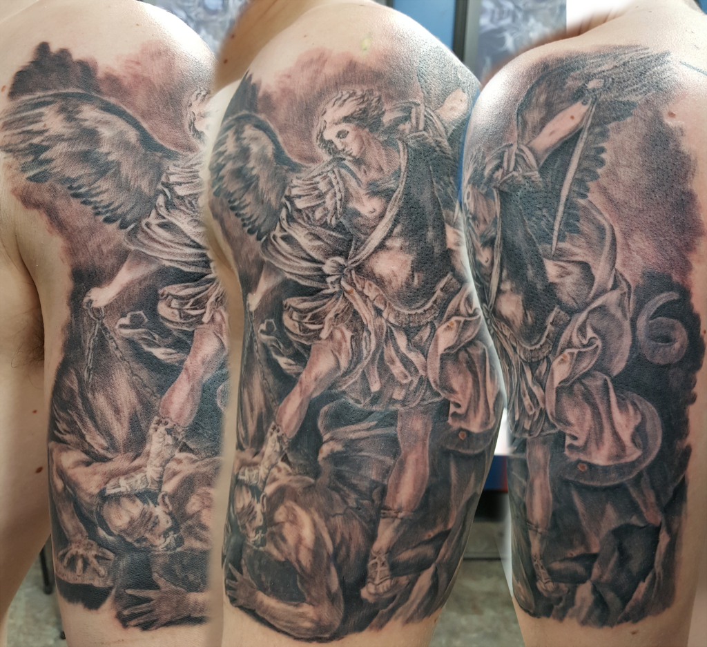 St Micahel tattoo adapted from Guido Reni painting. Realistic black and grey tattooing.